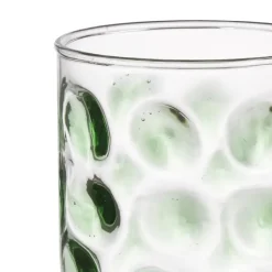 Glas met groene stippen